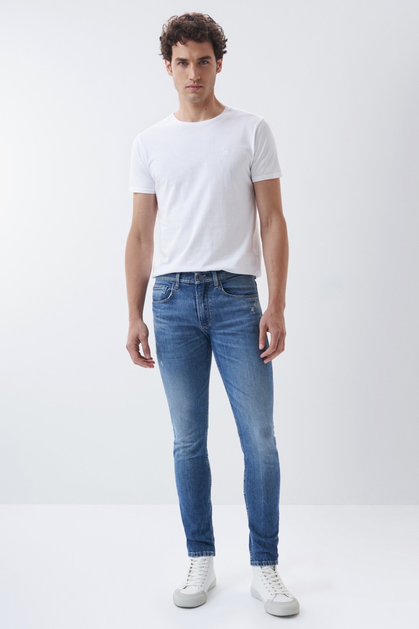 JEANS SLIM COR MDIA COM LIGEIROS ROTOS