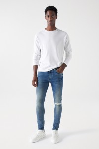 JEAN SKINNY AVEC DCHIRURES ET FERMETURE CLAIR