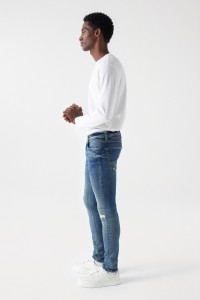 JEAN SKINNY AVEC DCHIRURES ET FERMETURE CLAIR